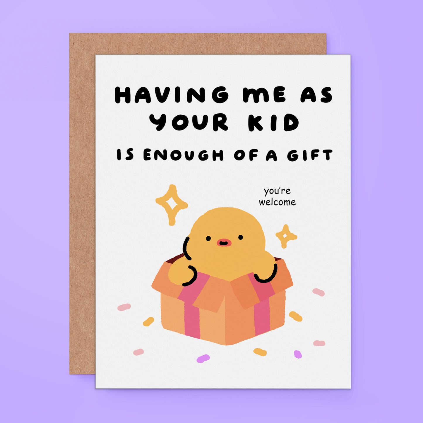 A greeting card with a brown kraft envelope, featuring a cute cartoon chick popping out of a gift box with the text 'HAVING ME AS YOUR KID IS ENOUGH OF A GIFT' and 'you're welcome' on a light purple background.