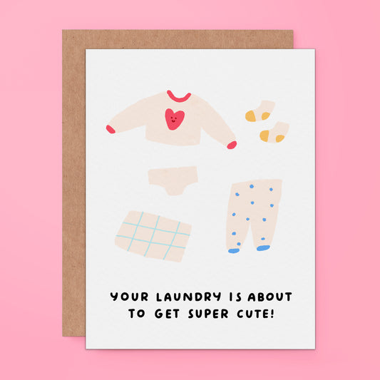 Greeting card of tiny baby clothes. The text on the card reads, "Your laundry is about to get super cute!" For new mom to be