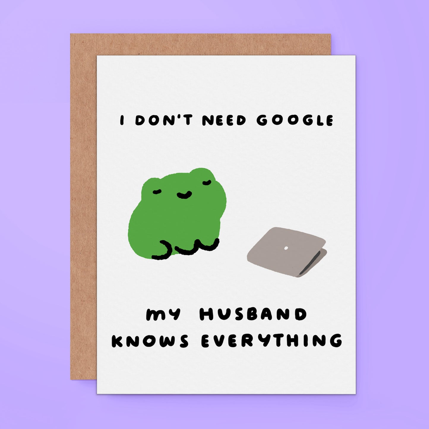 A greeting card featuring a cute green frog illustration next to a gray laptop and the text 'I DON'T NEED GOOGLE MY HUSBAND KNOWS EVERYTHING' on a light purple background.