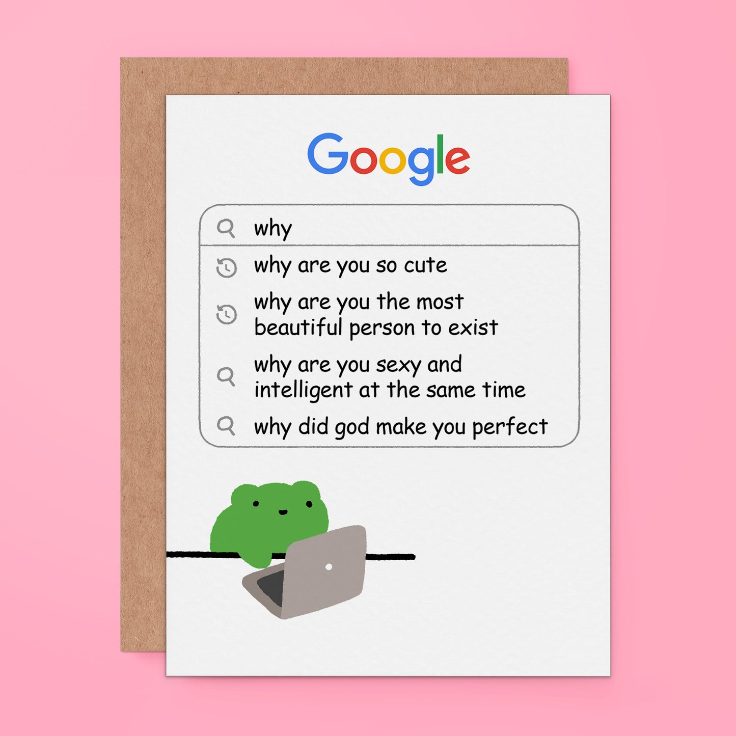 A white greeting card with a Google-themed design, featuring the Google logo and a search bar with humorous search queries. A small green frog is sitting on a laptop at the bottom.