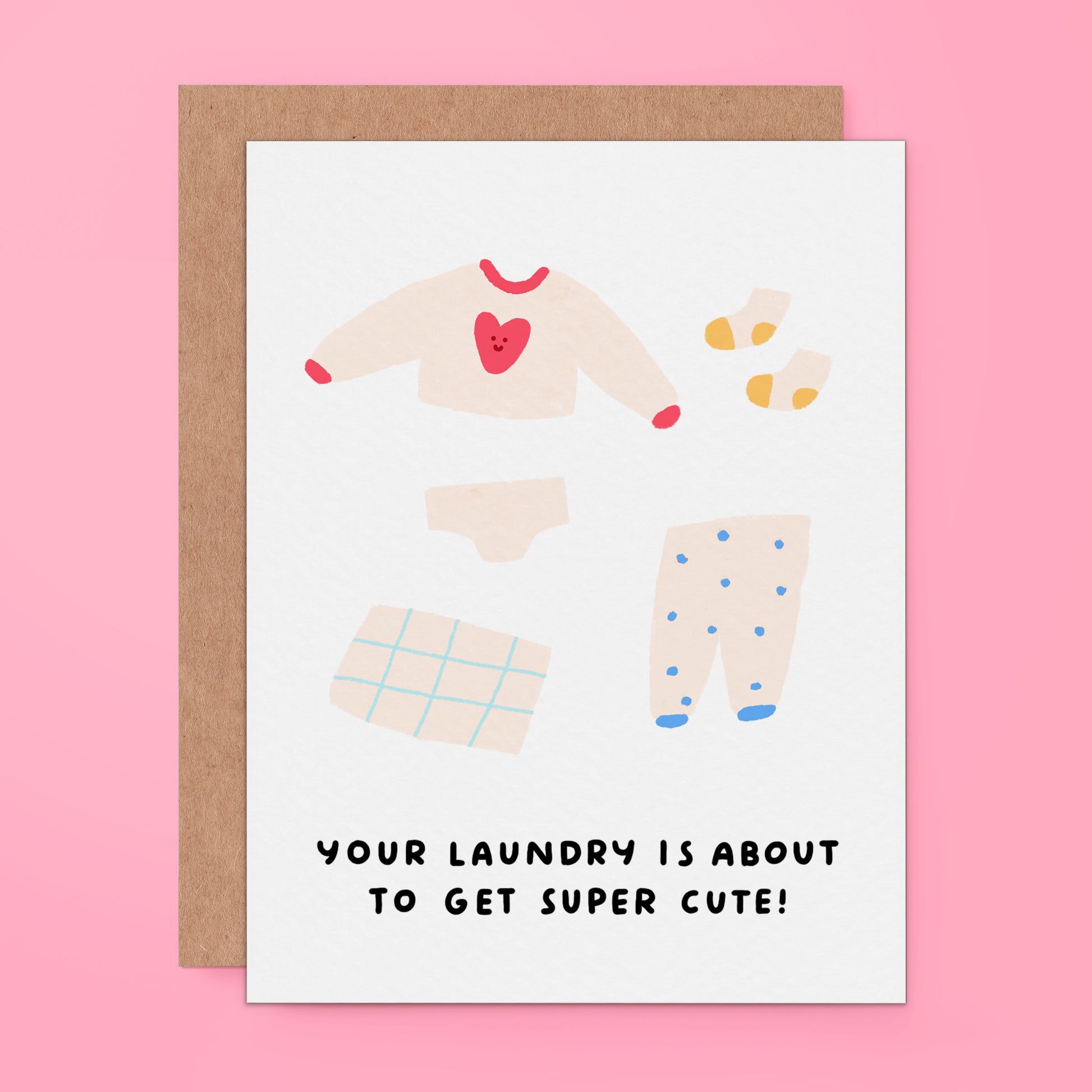 Greeting card of tiny baby clothes. The text on the card reads, "Your laundry is about to get super cute!" For new mom to be