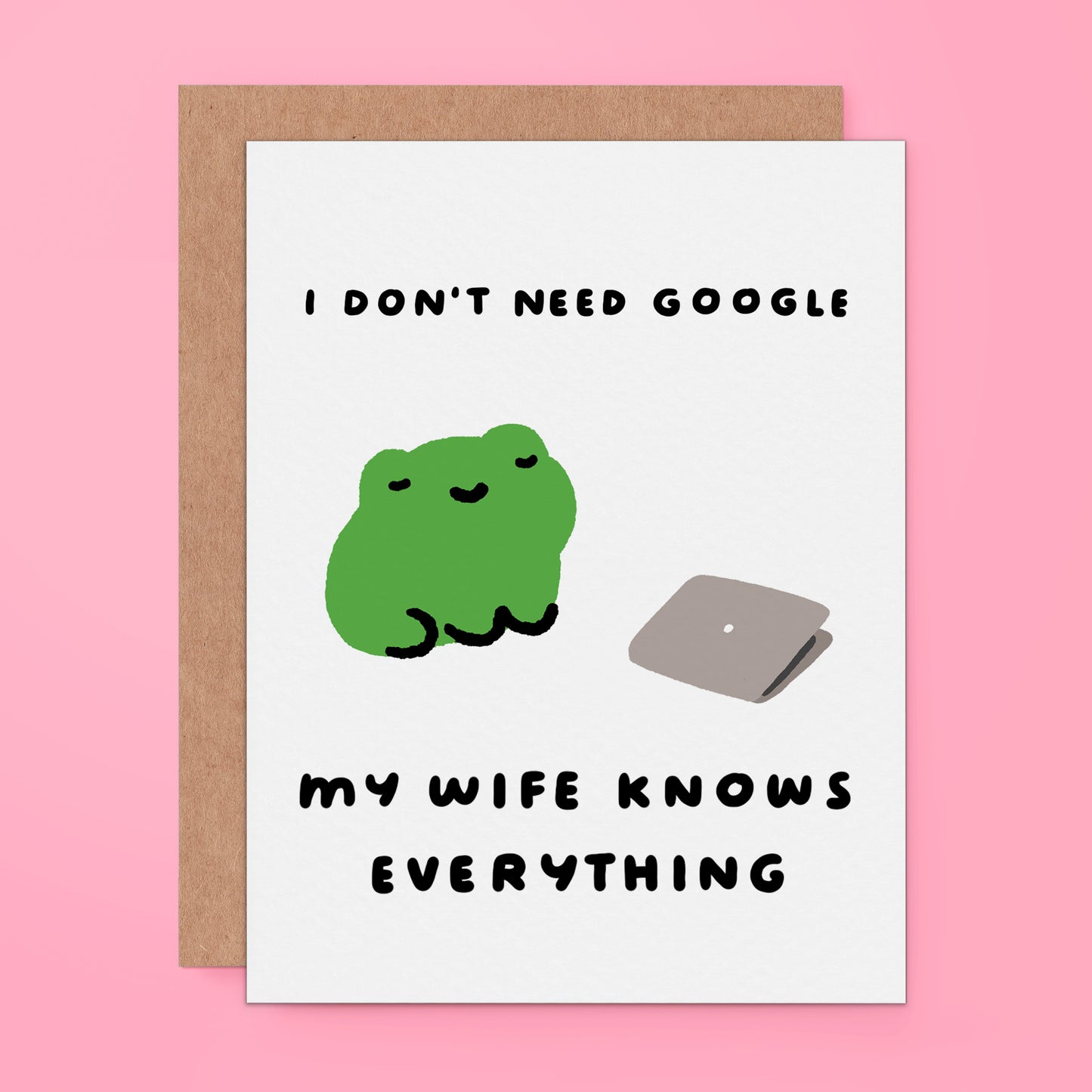 A greeting card featuring a green cartoon frog and a gray laptop with the text 'I DON'T NEED GOOGLE MY WIFE KNOWS EVERYTHING'.