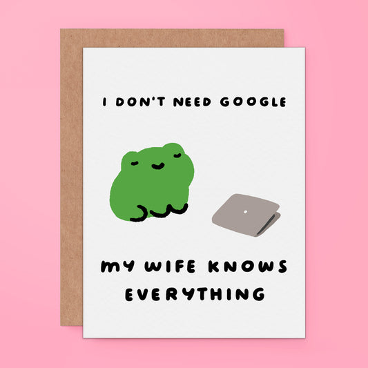 A greeting card featuring a green cartoon frog and a gray laptop with the text 'I DON'T NEED GOOGLE MY WIFE KNOWS EVERYTHING'.